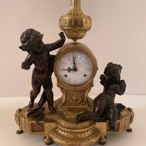 Orologio da caminetto con putti in stile Impero