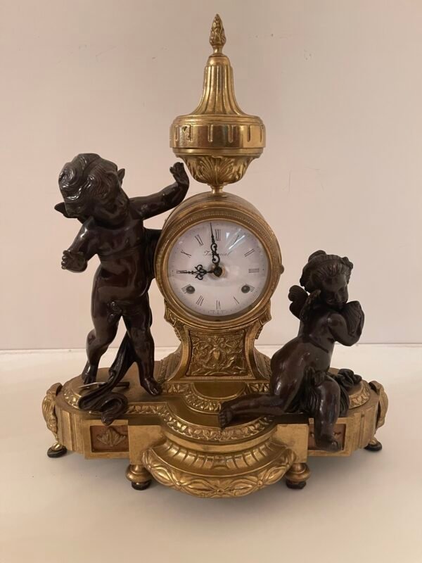 Orologio da caminetto con putti in stile Impero