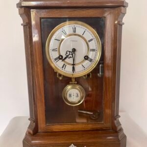 Orologio a pendolo da tavolo Kienzle in legno massello, carica manuale